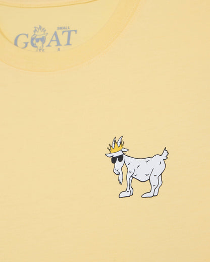 Yellow t-shirt with a cartoon goat wearing a crown and sunglasses on a yellow background.#color_corn-milk