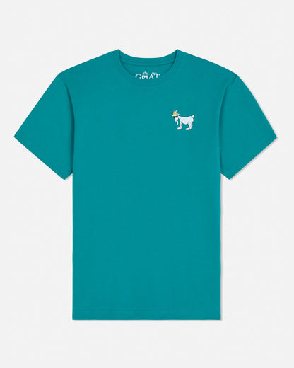 Teal t-shirt with a small graphic on a white background#color_teal-blue