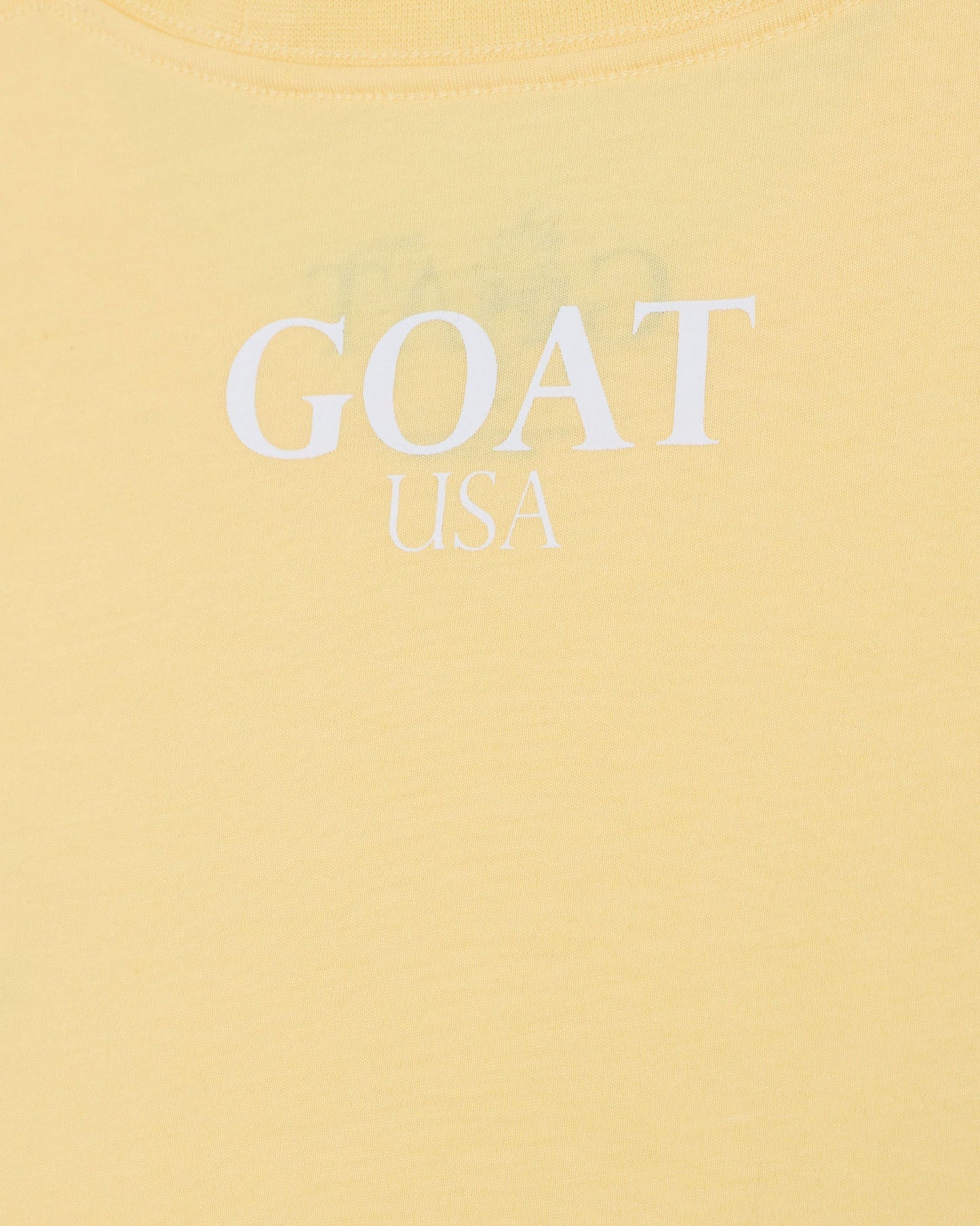Yellow t-shirt with 'GOAT USA' text on a yellow background#color_corn-milk