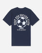 A navy blue short-sleeve t-shirt with a white graphic on the back featuring a soccer ball and the text 'GOAT USA SOCCER CLUB' and 'be the greatest'.
