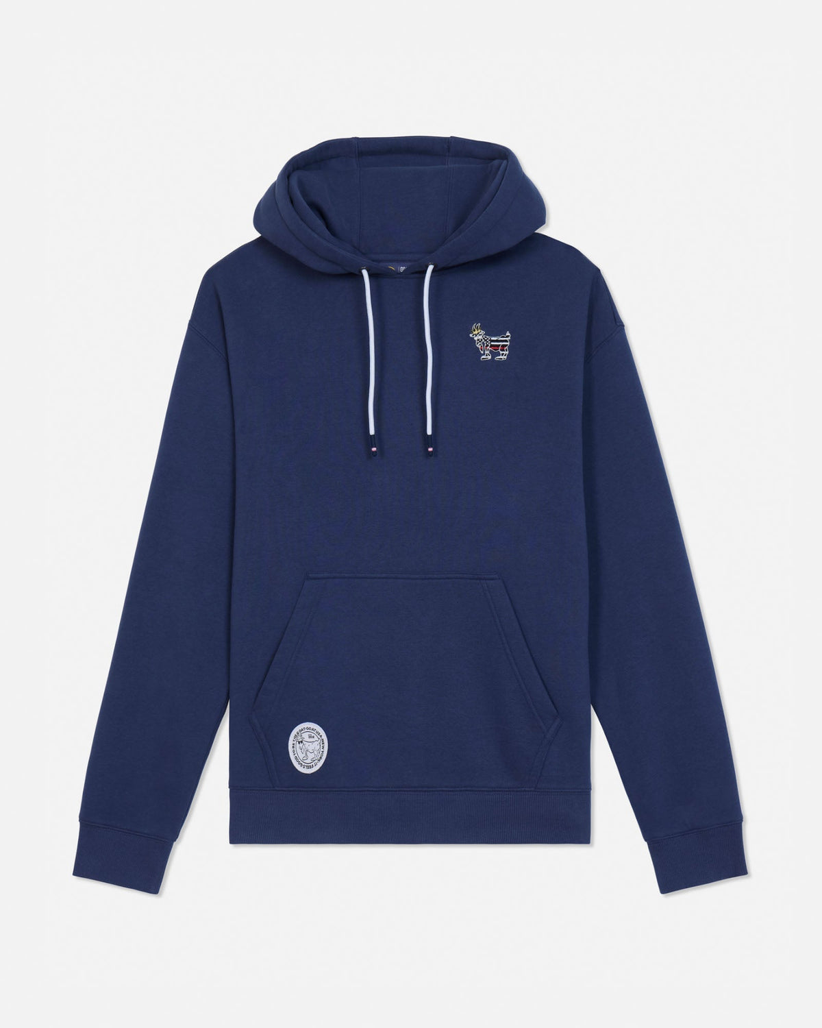 A navy blue pullover hoodie with white drawstrings, featuring a small embroidered graphic on the left chest and a circular patch on the lower left front pocket, displayed against a light gray background.