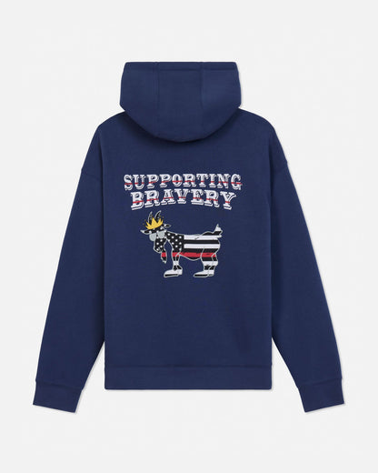 A navy blue pullover hoodie shown from the back, featuring a graphic of a goat wearing a US flag pattern and a small gold crown, with the text 'SUPPORTING BRAVERY' above it.