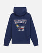 A navy blue pullover hoodie shown from the back, featuring a graphic of a goat wearing a US flag pattern and a small gold crown, with the text 'SUPPORTING BRAVERY' above it.