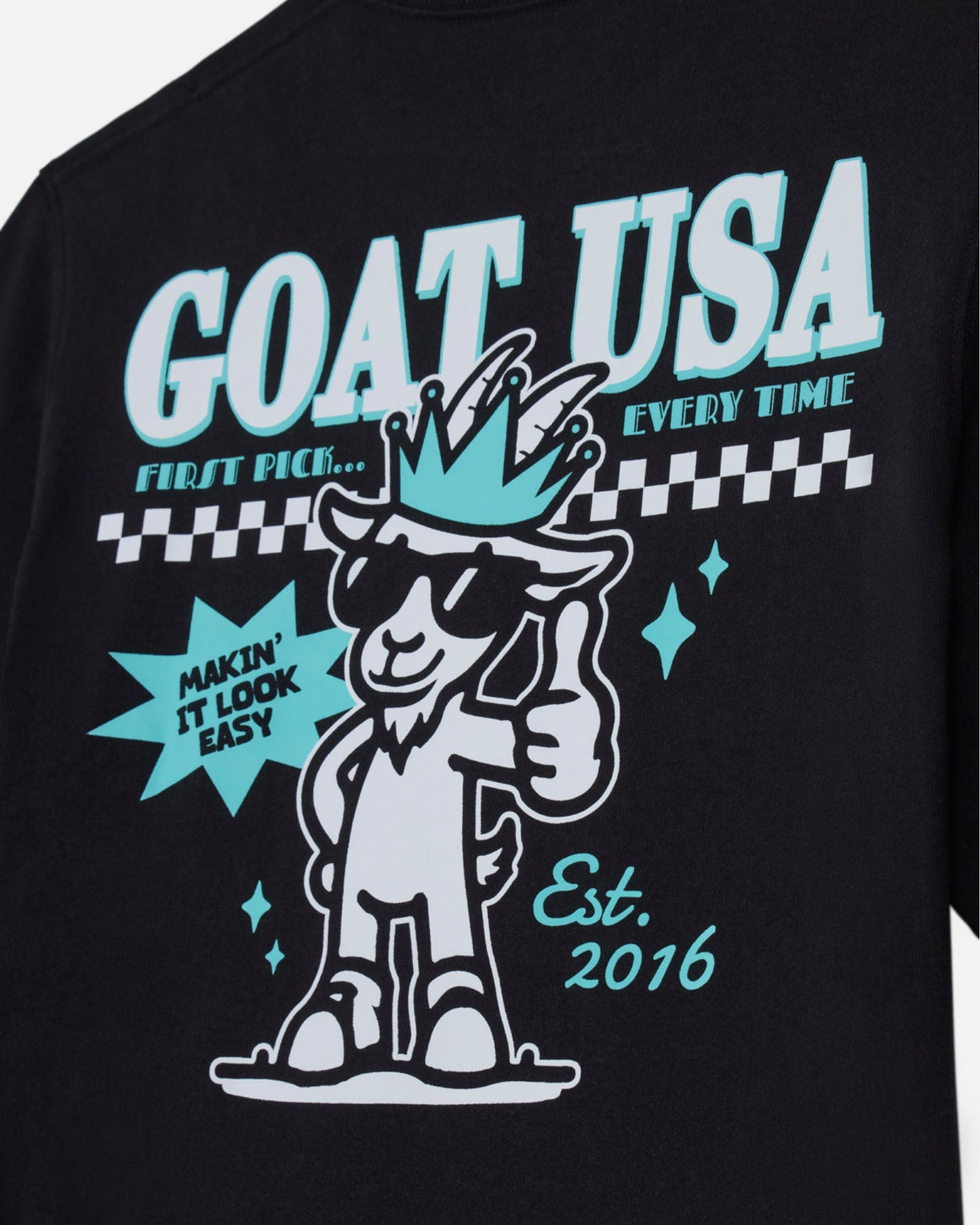 Black t-shirt with 'GOAT USA' graphic design featuring a cartoon goat with a crown and text.