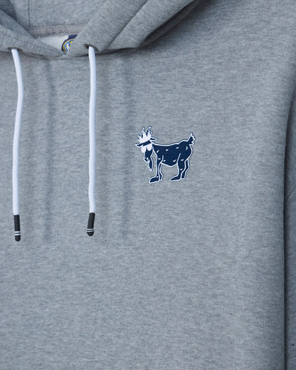 Close-up of a heather gray hoodie with white drawstrings and a small navy goat logo embroidered on the left chest.#color_gray
