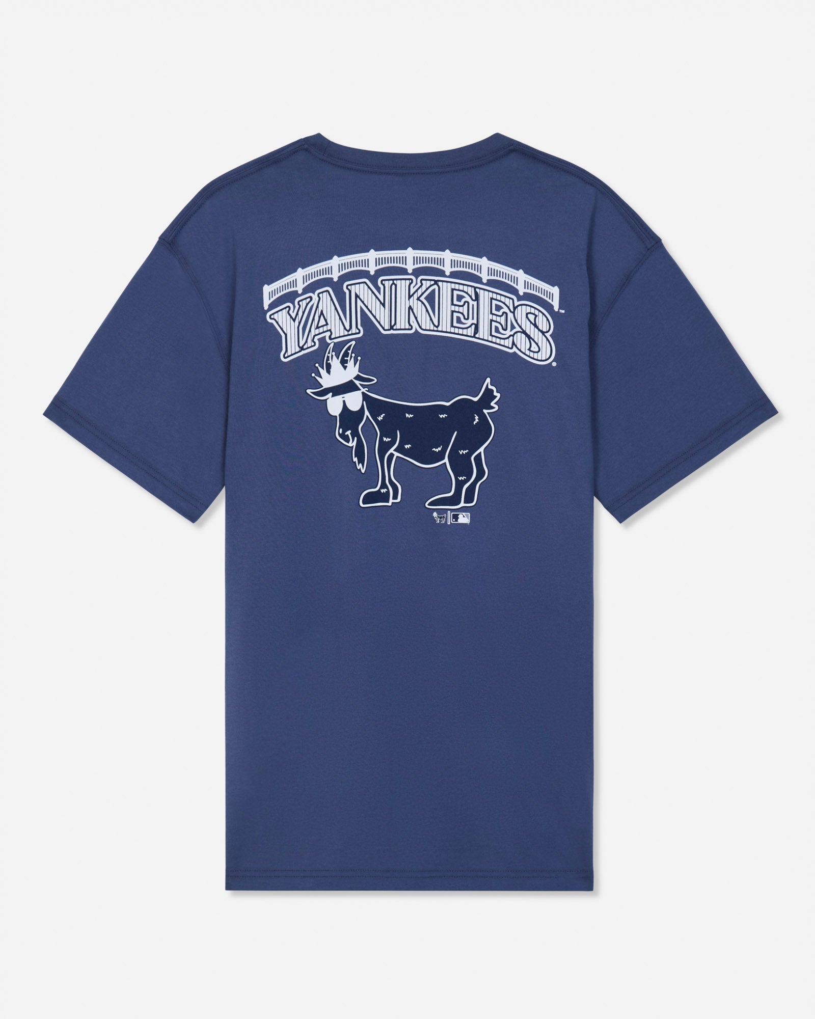 A navy blue short-sleeve t-shirt with a white graphic on the back featuring the word 'YANKEES' in an arched font above a detailed goat mascot illustration, set against a light gray background.#color_navy