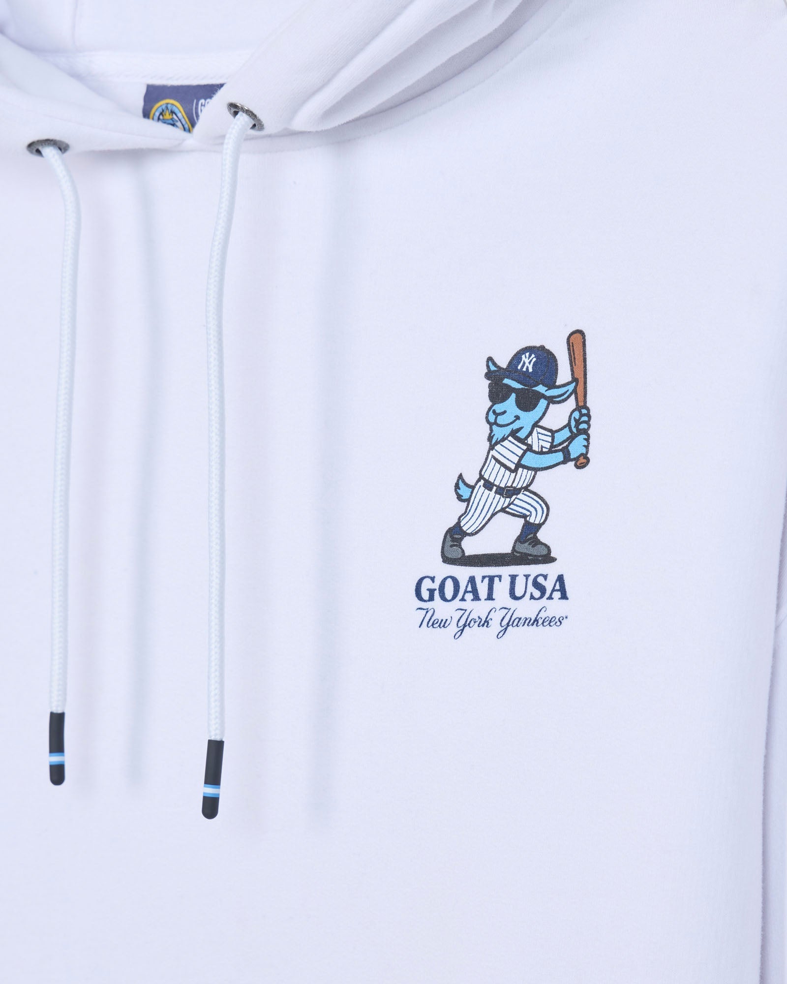 Close-up of left chest design with blue baseball player goat mascot in a New York Yankees uniform