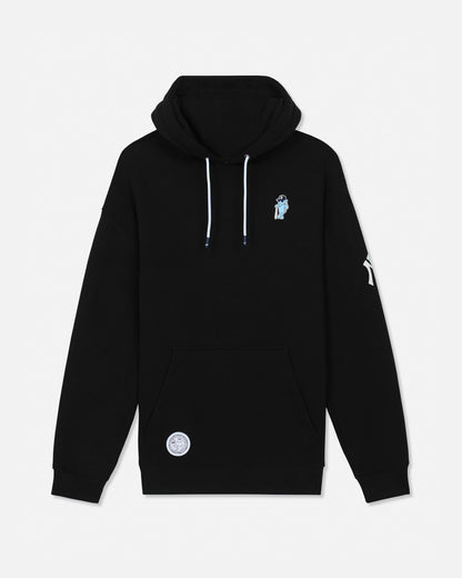 A black pullover hoodie with white drawstrings, featuring a small light blue graphic on the left chest and a white circular patch on the lower front pocket, displayed against a light gray background.