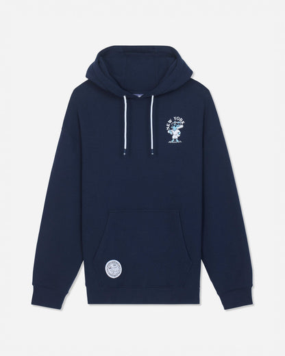 A navy blue pullover hoodie with white drawstrings, featuring a white graphic print on the left chest and a circular white patch on the lower left front pocket, displayed against a light gray background.