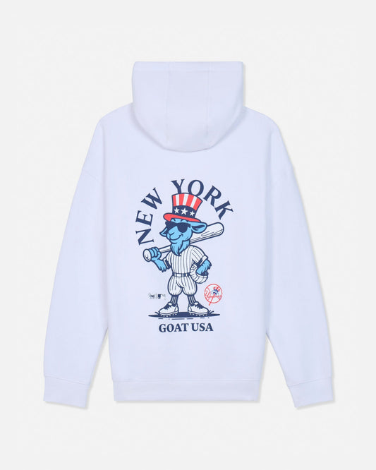 White pullover hoodie shown from the back, featuring a large graphic print of a cartoon blue goat in a baseball uniform with a red, white, and blue top hat, surrounded by the text 'NEW YORK GOAT USA'.#color_white