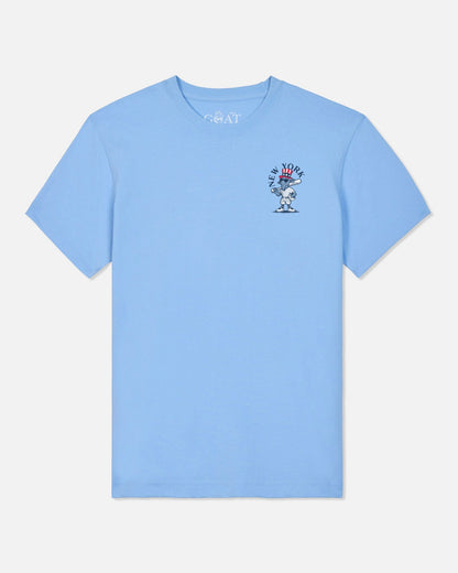 A light blue short-sleeve crewneck t-shirt with a small graphic on the left chest and 'GOAT' printed inside the collar, shown against a light gray background.#color_carolina-blue