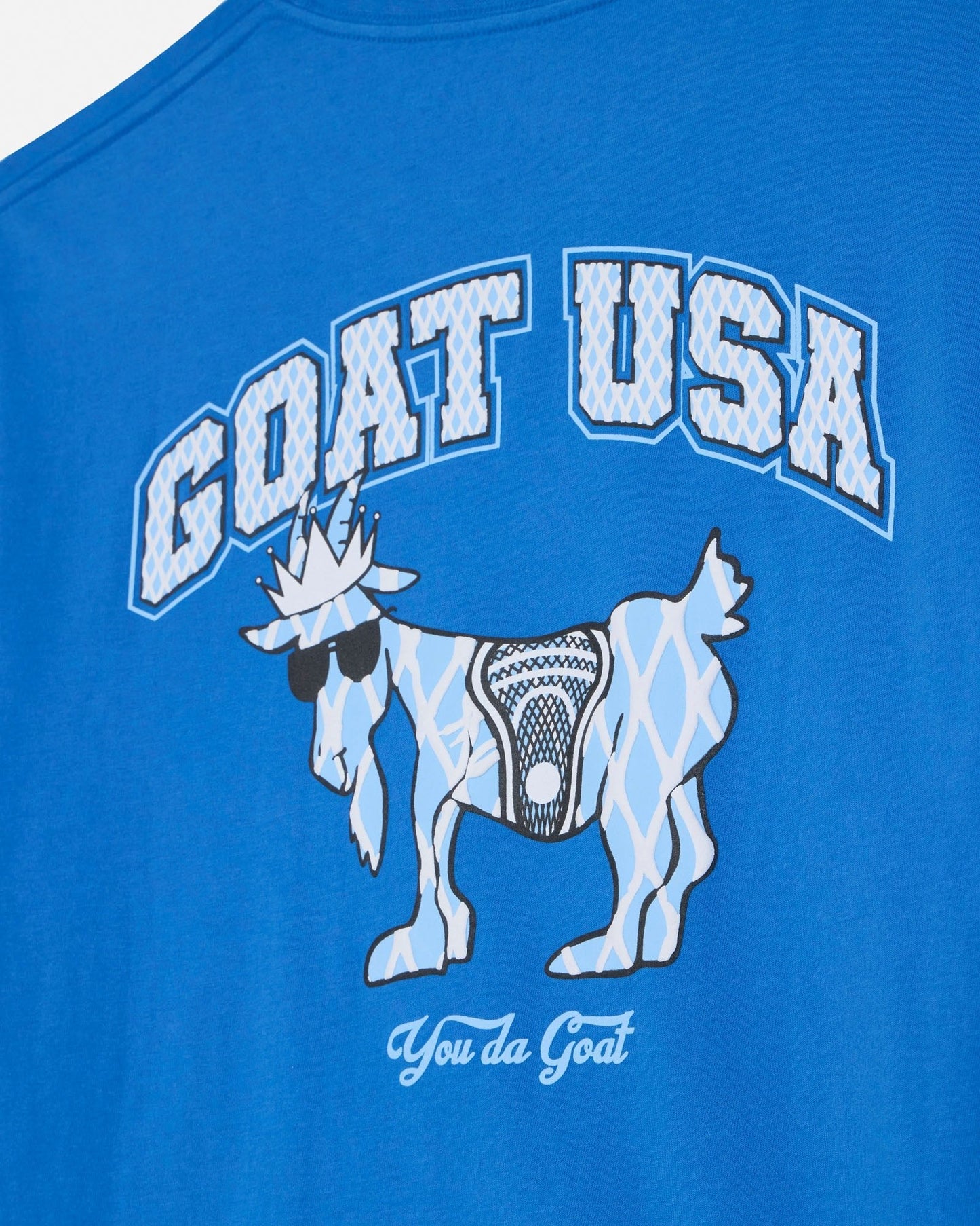 Blue t-shirt with 'GOAT USA' and graphic of a goat holding a basketball on a white background