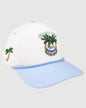 Cream hat with blue rope and brim. Features a palm tree sunset design