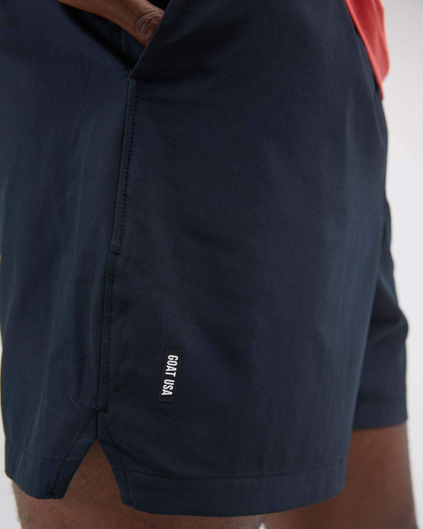 Black shorts with a brand logo on a white background#color_black