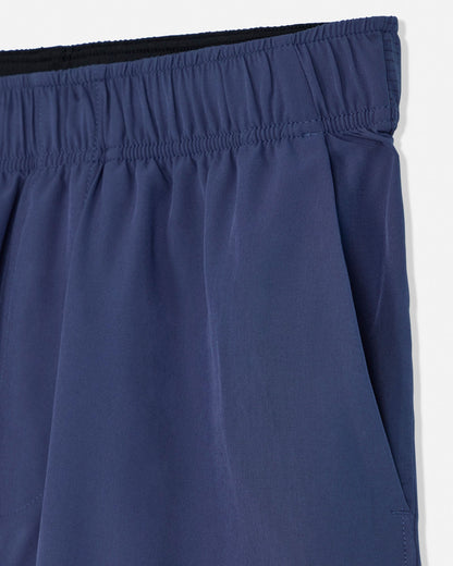 Close-up of blue shorts with an elastic waistband on a white background#color_navy
