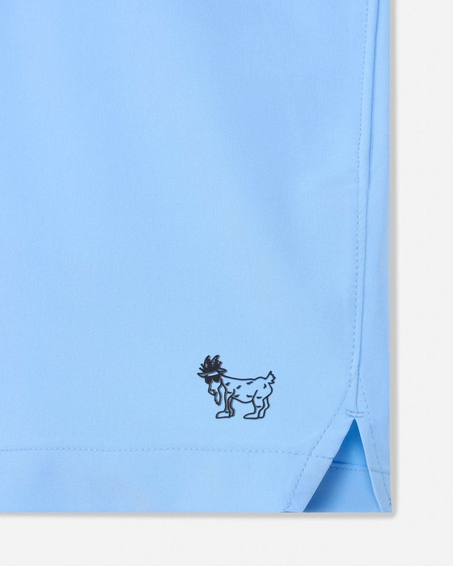 Light blue fabric with a small black embroidered design on a white background#color_carolina-blue