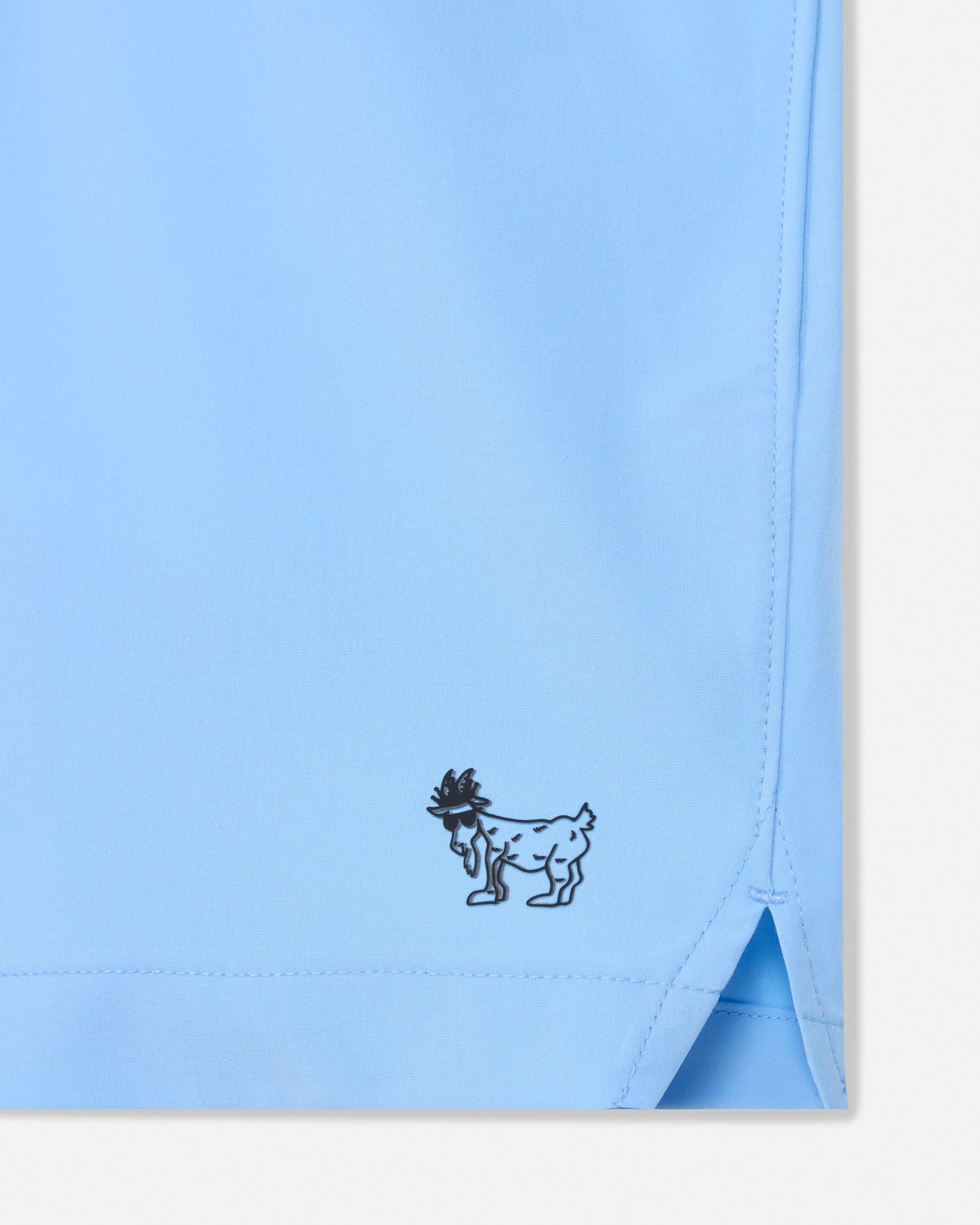 Light blue fabric with a small black embroidered design on a white background#color_carolina-blue