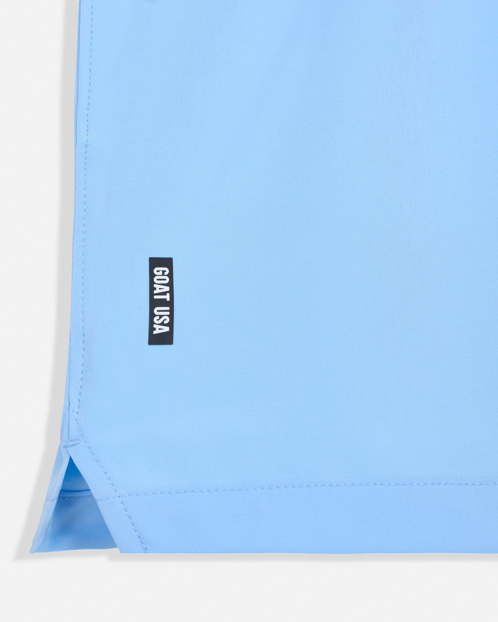 Light blue fabric with a black 'GOAT USA' label on a white background#color_carolina-blue