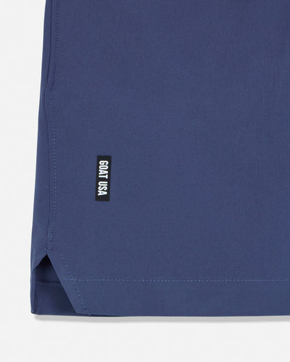 Navy blue fabric with a small black label on a white background#color_navy