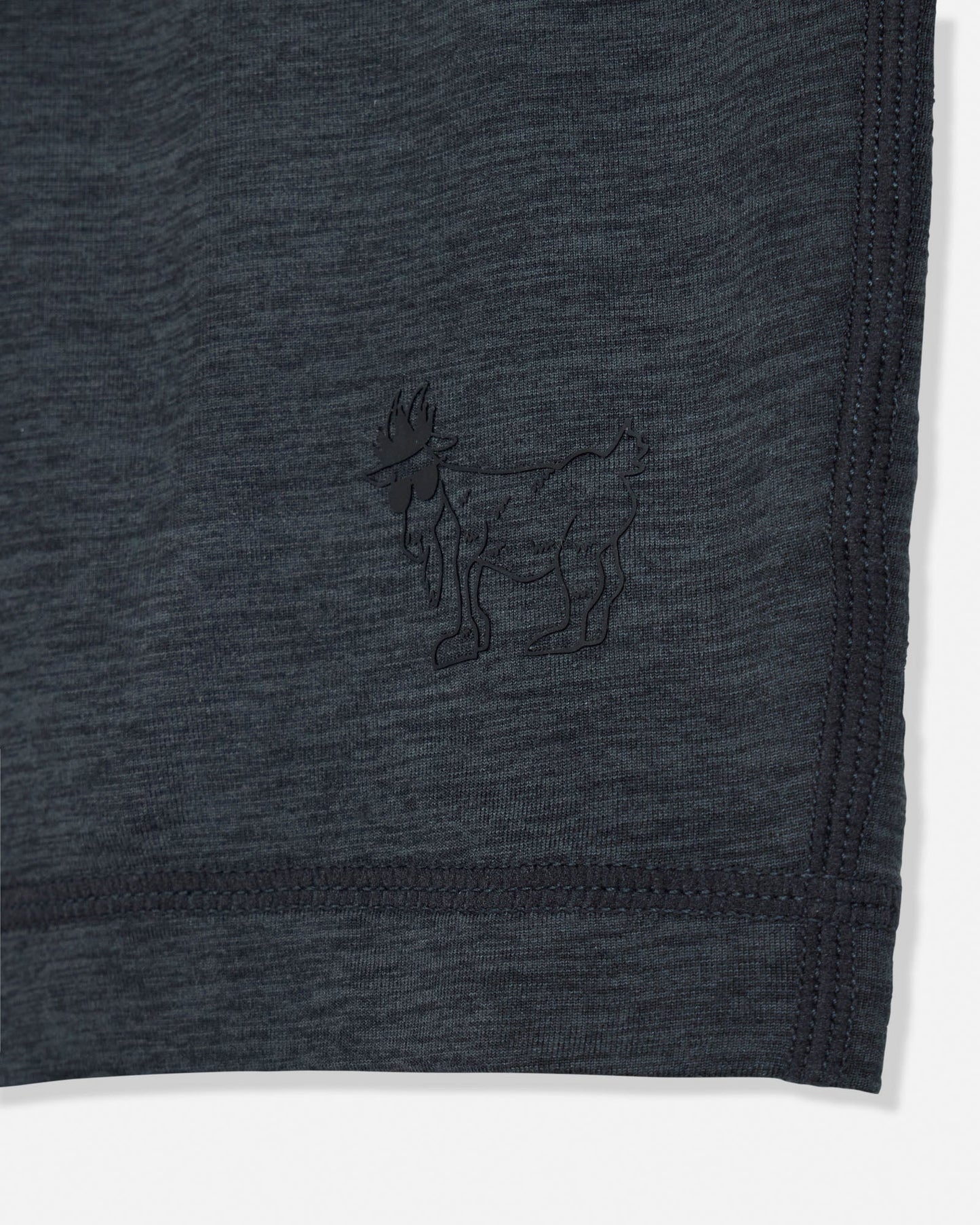 Dark gray fabric with a small embroidered design of a goat on a white background#color_space-dye-black