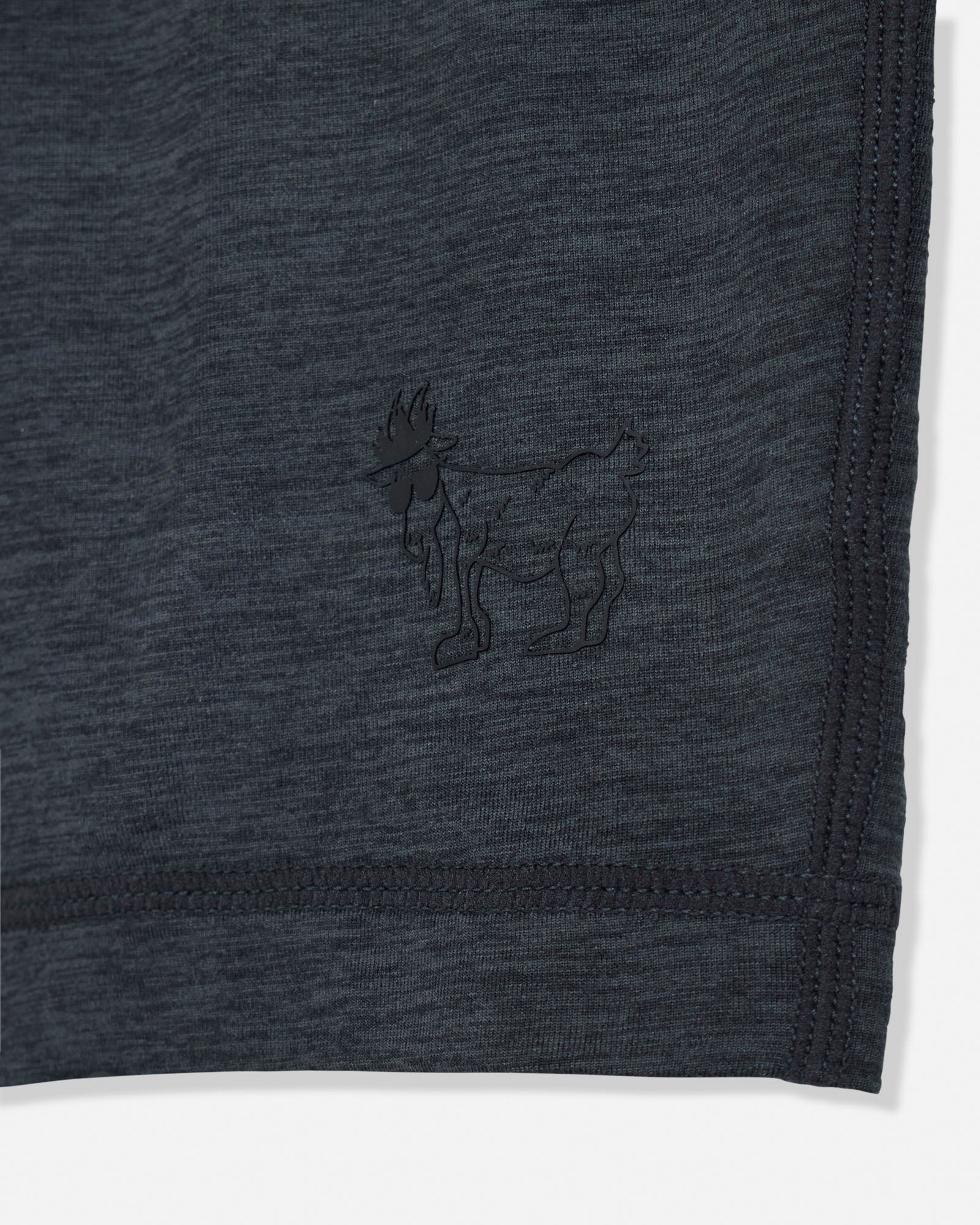 Dark gray fabric with a small embroidered design of a goat on a white background#color_space-dye-black