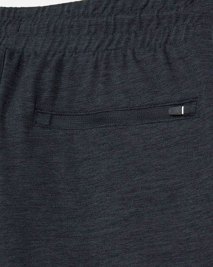 Close-up of dark gray shorts with a pocket and button.#color_space-dye-black