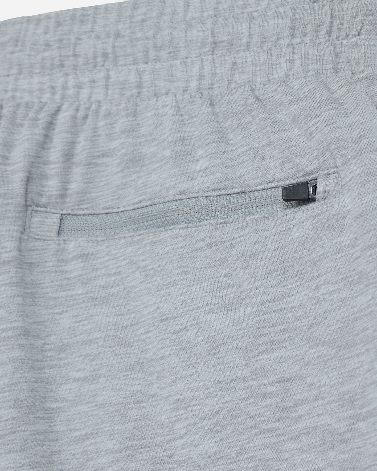 Close-up of gray shorts with a zipper pocket#color_space-dye-gray