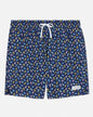 Navy swim shorts with colorful goat pattern on a light gray background
