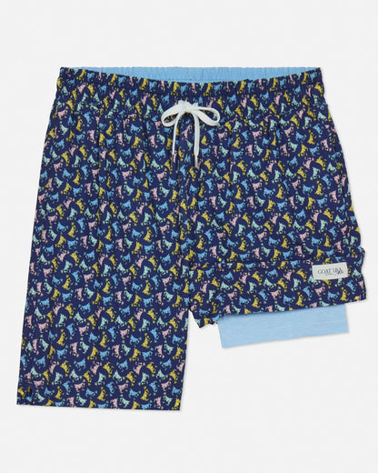 Navy swim shorts with colorful goat pattern on a light gray background