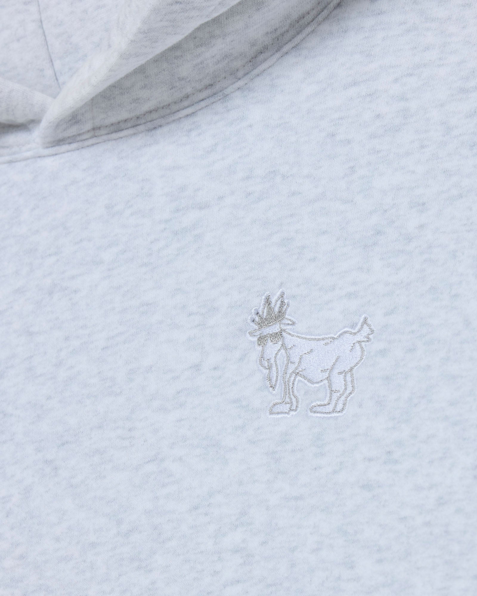 Light gray hoodie with a subtle embroidered design on the chest.#color_pale-gray