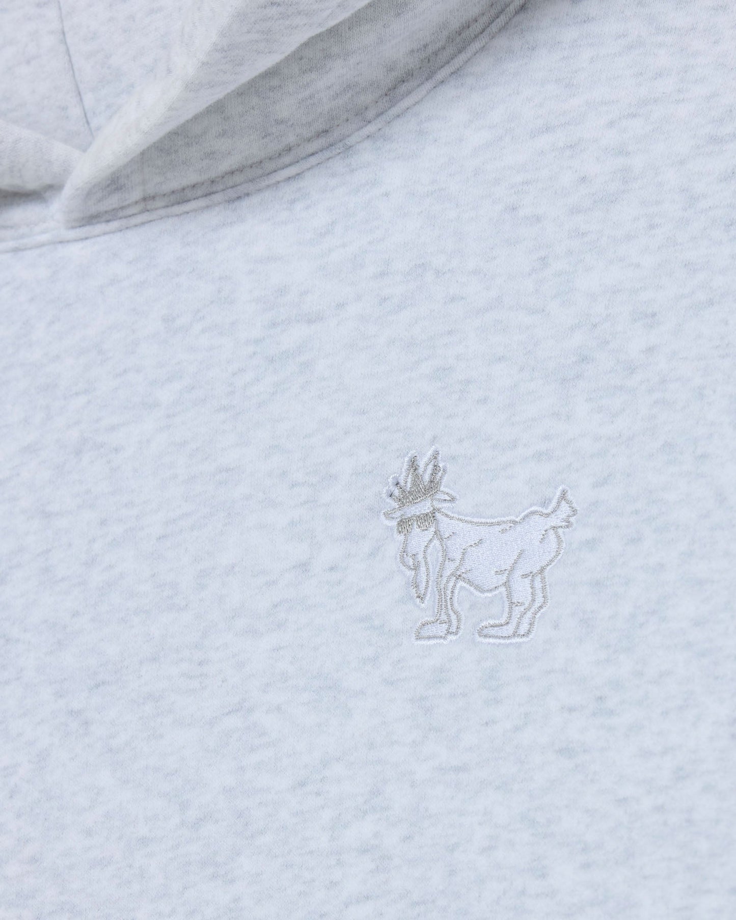 Light gray hoodie with a subtle embroidered design on the chest.#color_pale-gray