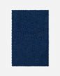 A dark navy blue rectangular blanket with a textured, embossed checkerboard pattern and fringed edges, shown flat against a light gray background.