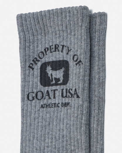 Gray socks with 'Property of Goat USA' logo on a white background