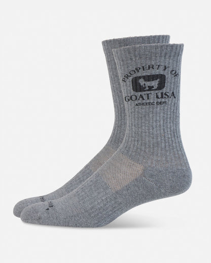 Gray socks with 'Property of GOAT USA' logo on a white background