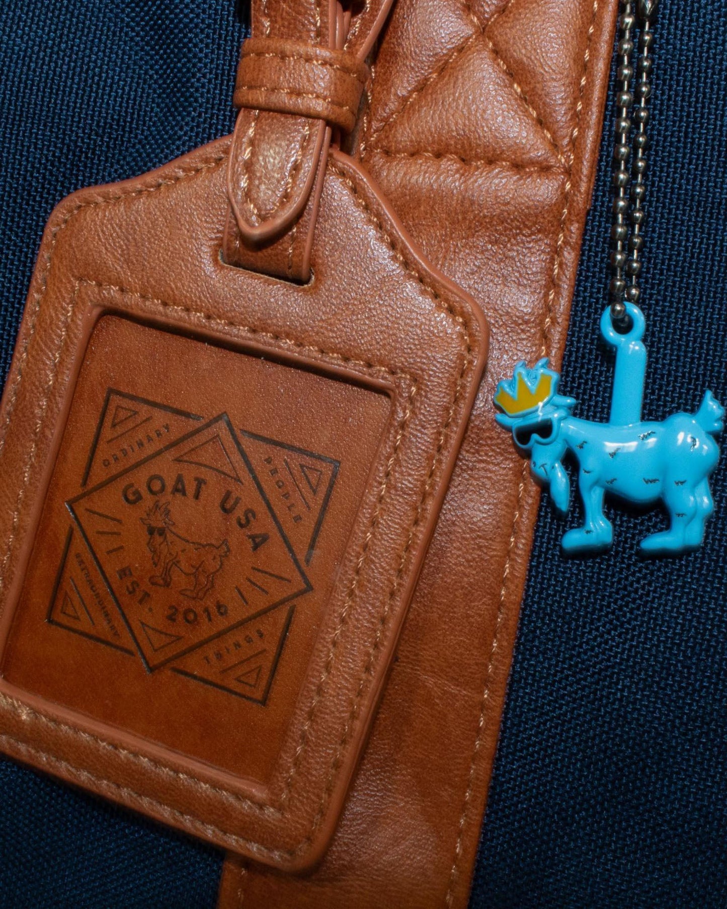 Luggage tags on navy OG Duffel Bag#color_navy