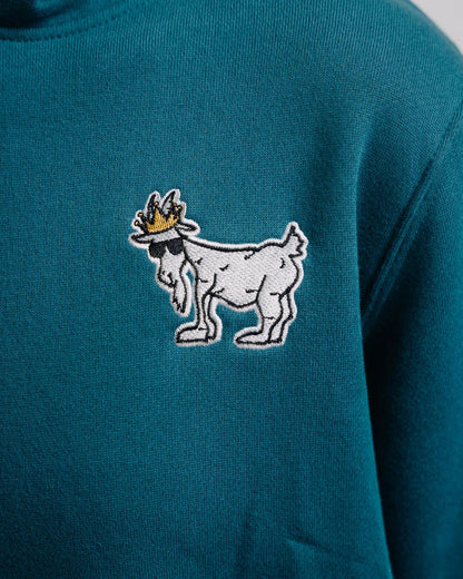 Close-up of logo on emerald WG Hooded Sweatshirt#color_emerald