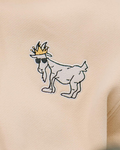 Close-up of logo on sandshell WG Hooded Sweatshirt#color_sandshell