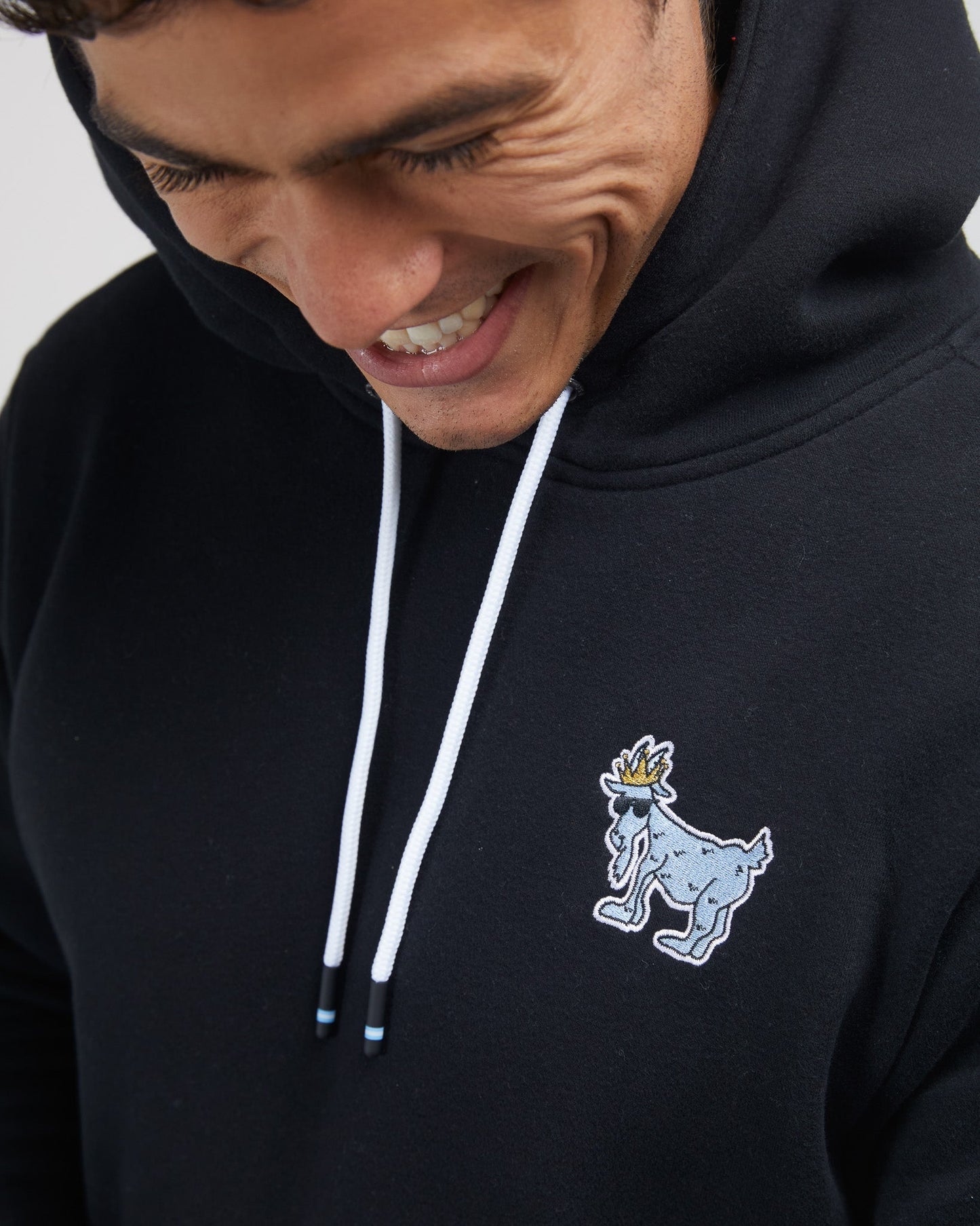Close up of embroidered logo on left chest#color_black