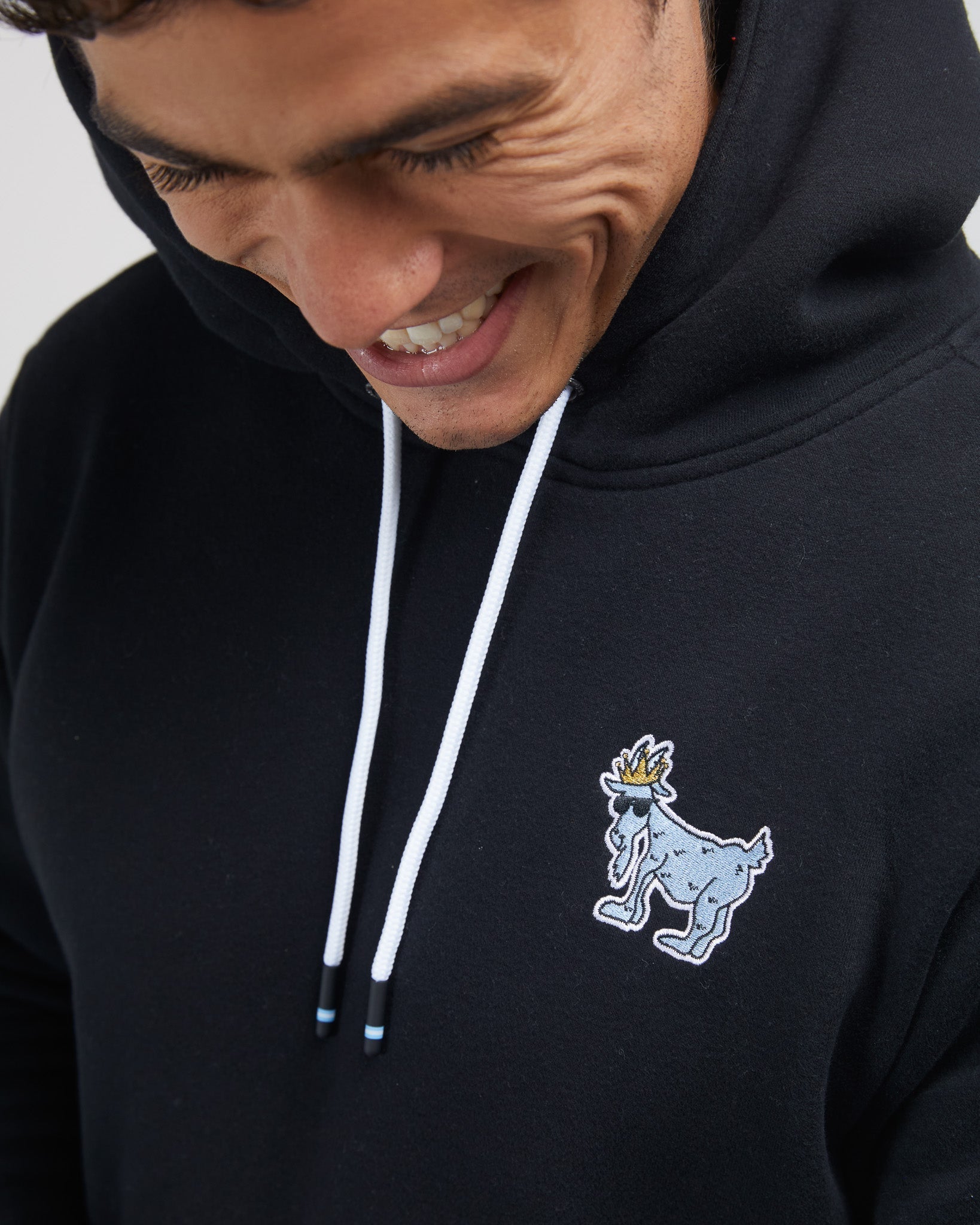 Close up of embroidered logo on left chest#color_black