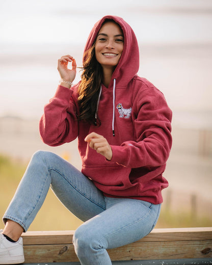 Woman sitting on railing while wearing cardinal WG Hooded Sweatshirt#color_cardinal