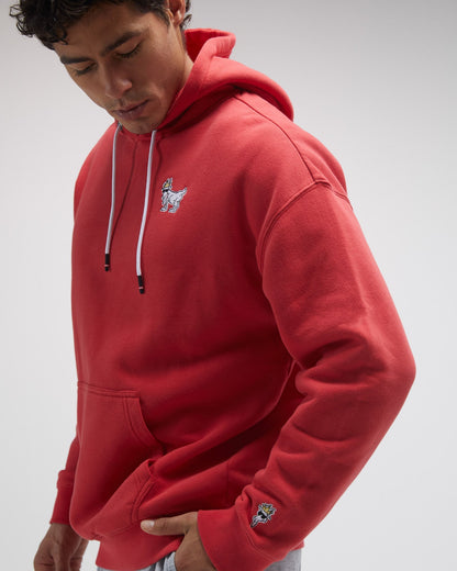 Model wearing red sweatshirt on a ight-gray background#color_poinsettia