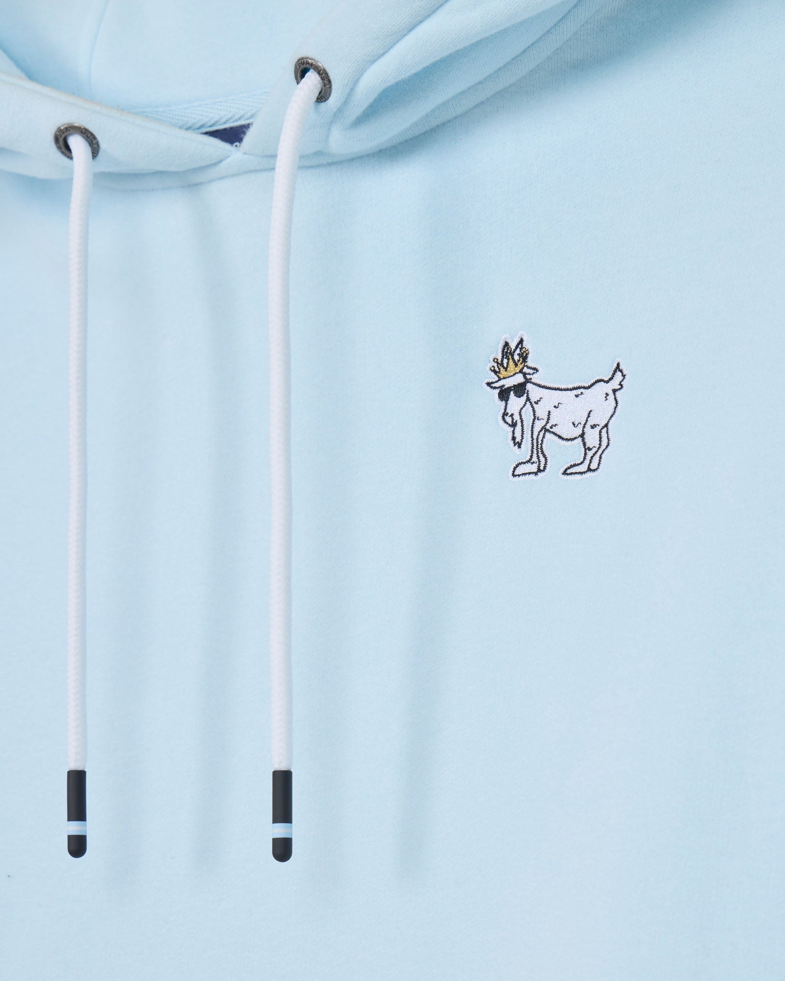 Light blue hoodie with a small graphic of a goat wearing a crown on the chest.#color_delicate-blue