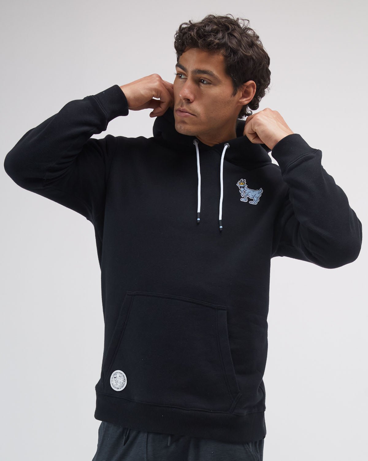 Person wearing black OG hooded sweatshirt#color_black