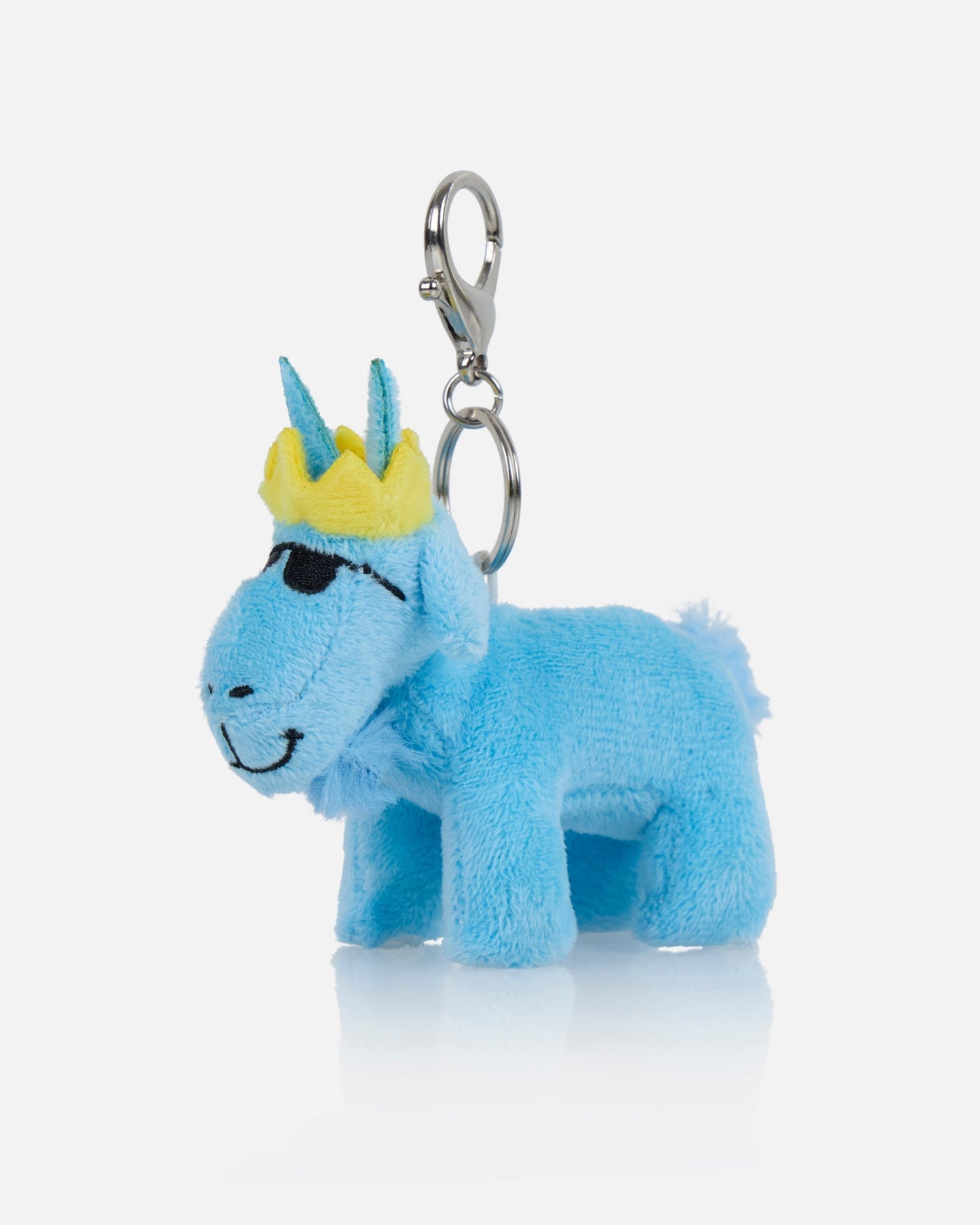 Blue plush keychain with a yellow crown on a white background