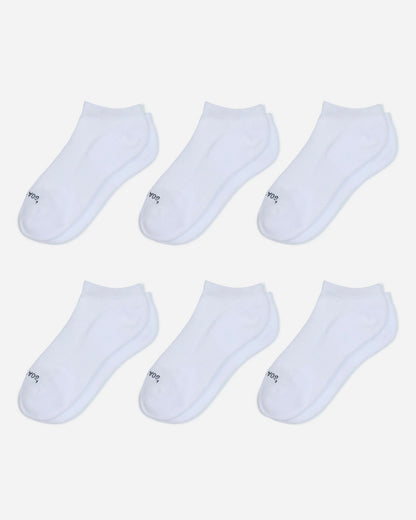 Set of six white ankle socks on a light gray background