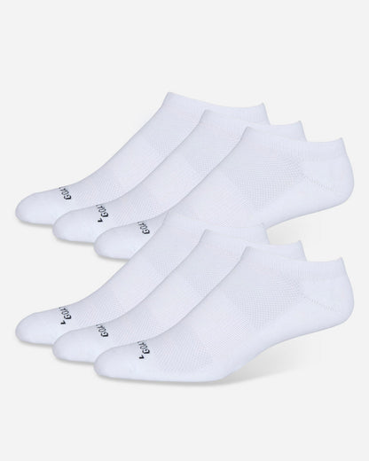 Set of six white ankle socks on a light gray background