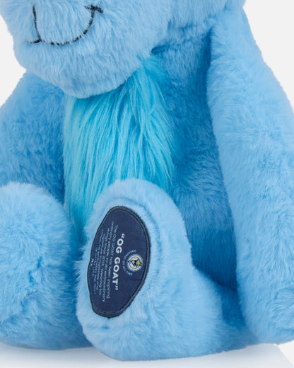 Close up of blue goat plushie