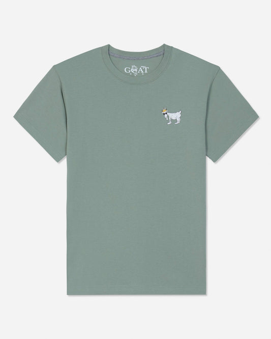 A sage green short-sleeve t-shirt with a small white embroidered goat logo on the left chest, displayed flat against a light gray background.#color_steeped-sage