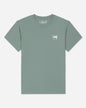 A sage green short-sleeve t-shirt with a small white embroidered goat logo on the left chest, displayed flat against a light gray background.#color_steeped-sage