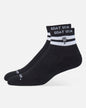 A pair of black ankle socks with white stripes and 'GOAT USA' branding on the cuff, displayed against a light gray background.#color_black